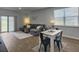 Open living room and dining area with sliding glass doors and modern furnishings at 215 Sweet Cherry Ln, Summerville, SC 29486