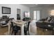 Open living room and dining area layout with wood floors and neutral decor at 215 Sweet Cherry Ln, Summerville, SC 29486