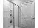 Modern glass-enclosed shower features tiled walls, built in shelves and a sleek design at 215 Sweet Cherry Ln, Summerville, SC 29486
