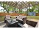 Backyard featuring a spacious patio with outdoor seating and a shed in a fenced yard, ideal for outdoor living at 2158 Till Rd, Charleston, SC 29414