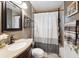 Bathroom showcasing vanity, shower with curtain, and neutral tile at 2158 Till Rd, Charleston, SC 29414