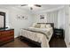 Comfortable bedroom featuring wood-look floors, ceiling fan, and neutral decor offering a serene living space at 2158 Till Rd, Charleston, SC 29414