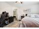 Bright bedroom setup with wood-look floors and a ceiling fan; another room visible through the doorway at 2158 Till Rd, Charleston, SC 29414
