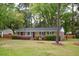 Charming one-story brick home with a well-manicured front yard, offering a welcoming curb appeal at 2158 Till Rd, Charleston, SC 29414