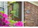 Inviting front door featuring glass panes and brick facade with house number at 2158 Till Rd, Charleston, SC 29414