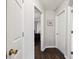 Bright hallway with white doors and wood-look floors providing a warm welcome to this inviting home at 2158 Till Rd, Charleston, SC 29414