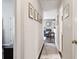 Hallway view looking toward living room with gray chair and modern decor at 2158 Till Rd, Charleston, SC 29414