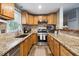 Bright kitchen with granite countertops and stainless steel appliances at 2158 Till Rd, Charleston, SC 29414