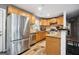 Well-lit kitchen featuring stainless steel appliances and light oak cabinets at 2158 Till Rd, Charleston, SC 29414