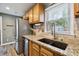 Kitchen with stainless steel fridge, granite counters, and ample storage space at 2158 Till Rd, Charleston, SC 29414