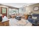 Comfortable living space with a sectional sofa, natural light, and stylish furnishings at 2158 Till Rd, Charleston, SC 29414