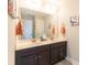 Bright bathroom featuring a double vanity with dark cabinets and matching framed art at 2160 Pentland Dr, Charleston, SC 29412