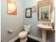 Modern bathroom features black wood floors, gray walls, and updated fixtures at 2160 Pentland Dr, Charleston, SC 29412