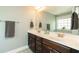 Bathroom features a double sink vanity with dark cabinets and neutral countertops at 2160 Pentland Dr, Charleston, SC 29412