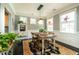 Traditional dining room with black wood floors, stylish lighting, and a beautiful area rug at 2160 Pentland Dr, Charleston, SC 29412