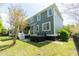 Two-story green house with a hot tub, back porch, and fenced yard at 2160 Pentland Dr, Charleston, SC 29412