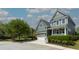 Charming two-story home with a front porch, a well-maintained yard, and an attached two-car garage at 2160 Pentland Dr, Charleston, SC 29412
