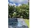 Hot tub overlooking lush backyard and pond at 2160 Pentland Dr, Charleston, SC 29412