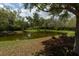 Scenic view of a tranquil pond surrounded by lush trees and foliage, perfect for relaxation at 2160 Pentland Dr, Charleston, SC 29412