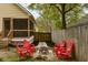 Backyard with a cozy fire pit area with a screened in back porch at 225 Hanahan Plantation Cir, Hanahan, SC 29410