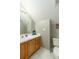 Compact bathroom with wooden cabinetry, ample counter space, and good lighting at 225 Hanahan Plantation Cir, Hanahan, SC 29410