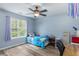 Bedroom with a window, ceiling fan, wood-look flooring and a view of the yard at 225 Hanahan Plantation Cir, Hanahan, SC 29410
