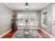 Dining room features a large window for natural light, and hardwood floors at 225 Hanahan Plantation Cir, Hanahan, SC 29410