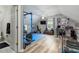 Spacious exercise room with weights, equipment, TV, and natural light from the window at 225 Hanahan Plantation Cir, Hanahan, SC 29410