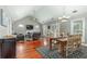Open-concept living and dining area with fireplace, hardwood floors and vaulted ceilings at 225 Hanahan Plantation Cir, Hanahan, SC 29410