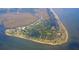 An aerial view of a coastal community surrounded by ocean waters at 229 Linkside Villas # 1/3 Share, Edisto Beach, SC 29438