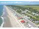 An aerial view of a beachfront community with a neighborhood by the beach at 229 Linkside Villas # 1/3 Share, Edisto Beach, SC 29438