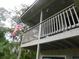 Cozy second story balcony with an American flag waving nearby at 229 Linkside Villas # 1/3 Share, Edisto Beach, SC 29438