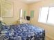 Bedroom features a dresser with a mirror and queen size bed with seashell bedding at 229 Linkside Villas # 1/3 Share, Edisto Beach, SC 29438