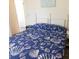 Bedroom features queen bed with seashell patterned bedding and beach themed decor at 229 Linkside Villas # 1/3 Share, Edisto Beach, SC 29438