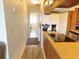 Galley kitchen shows cooktop stove on breakfast bar and hallway leading to a brightly lit room at 229 Linkside Villas # 1/3 Share, Edisto Beach, SC 29438