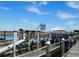 A marina along the water with a boardwalk for walking, and the American flag waving at 229 Linkside Villas # 1/3 Share, Edisto Beach, SC 29438