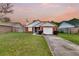 Lovely single-Gathering home with a green lawn, brick facade, and convenient attached garage at 234 Two Hitch Rd, Goose Creek, SC 29445