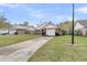 Exterior view of a brick home with an attached garage and a mature lawn at 234 Two Hitch Rd, Goose Creek, SC 29445