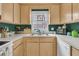 Bright kitchen with ample cabinet space, essential appliances, and a view of the yard at 234 Two Hitch Rd, Goose Creek, SC 29445
