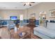 Large open living room with hardwood floors and blue-and-tan two-tone paint scheme at 234 Two Hitch Rd, Goose Creek, SC 29445