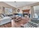 Cozy living room with fireplace, comfortable seating, and plenty of natural light at 234 Two Hitch Rd, Goose Creek, SC 29445