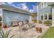 Backyard featuring a paved patio with seating and a grill, perfect for outdoor gatherings at 2383 Lenwick Hall Ln, Johns Island, SC 29455