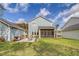 Well-maintained backyard with a screened porch, patio, outdoor seating and grill for relaxing and entertaining at 2383 Lenwick Hall Ln, Johns Island, SC 29455