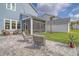 Spacious backyard showcasing a patio with outdoor seating and a view of the house at 2383 Lenwick Hall Ln, Johns Island, SC 29455
