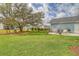 Spacious backyard featuring a paver patio with seating and a grill, perfect for outdoor entertaining at 2383 Lenwick Hall Ln, Johns Island, SC 29455