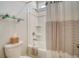 Bright bathroom showcases a tub, sleek fixtures, and a glass shower shelf at 2383 Lenwick Hall Ln, Johns Island, SC 29455