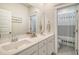 Clean bathroom offers dual sinks, ample counter space, and a convenient shower area at 2383 Lenwick Hall Ln, Johns Island, SC 29455