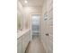 Well-lit bathroom features a white vanity, modern fixtures, and a separate toilet room at 2383 Lenwick Hall Ln, Johns Island, SC 29455