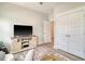 Inviting bedroom features a cozy seating area, a modern ceiling fan, and closet at 2383 Lenwick Hall Ln, Johns Island, SC 29455