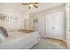 Cozy bedroom with comfortable bed, ceiling fan, closet and a door leading to a possible balcony at 2383 Lenwick Hall Ln, Johns Island, SC 29455
